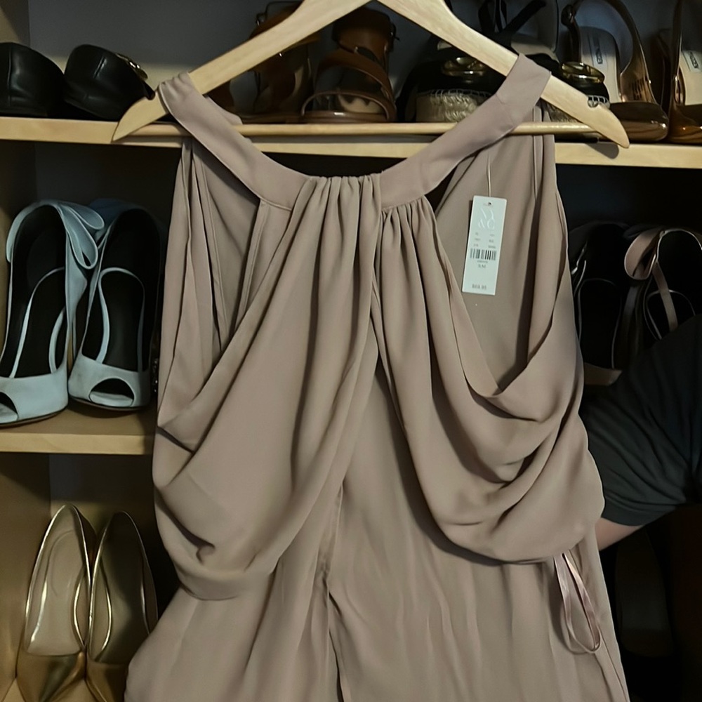 Beige long shirt with slits in the front and side.Never worn tag still attached